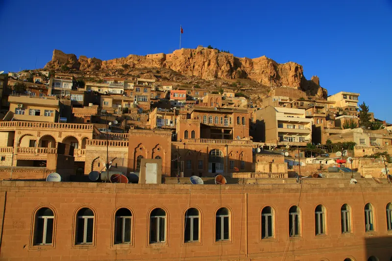 Mardin old town stone houses climbing toward the castle